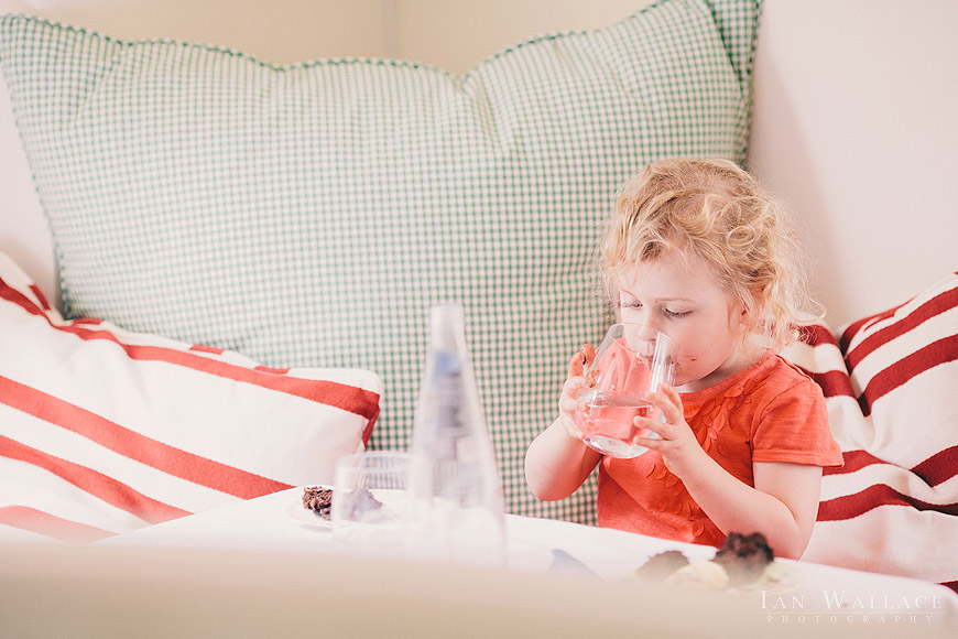 A child enjoying a drink in a restaurant in London