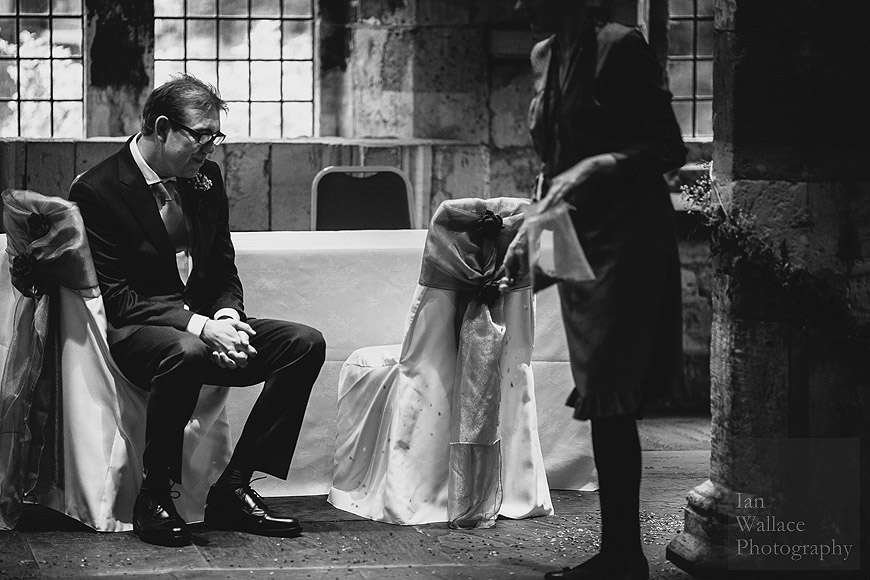 Natural photo of a thoughtful groom waiting for the ceremony to start