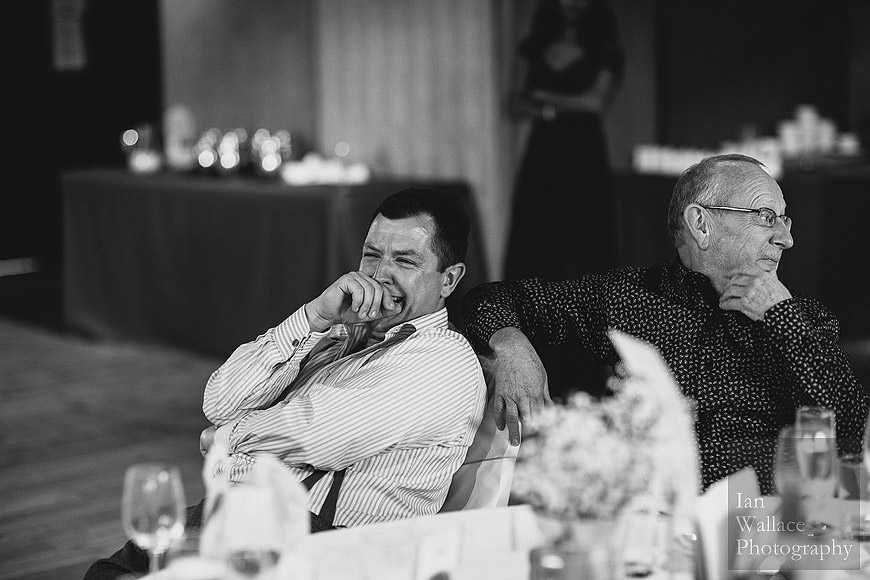 Documentary photograph of guests laughing at speeches