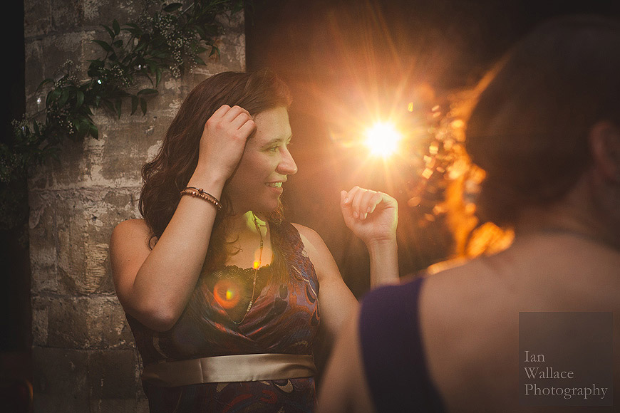 Lady dancing, backlit with disco lights at York Hospitium