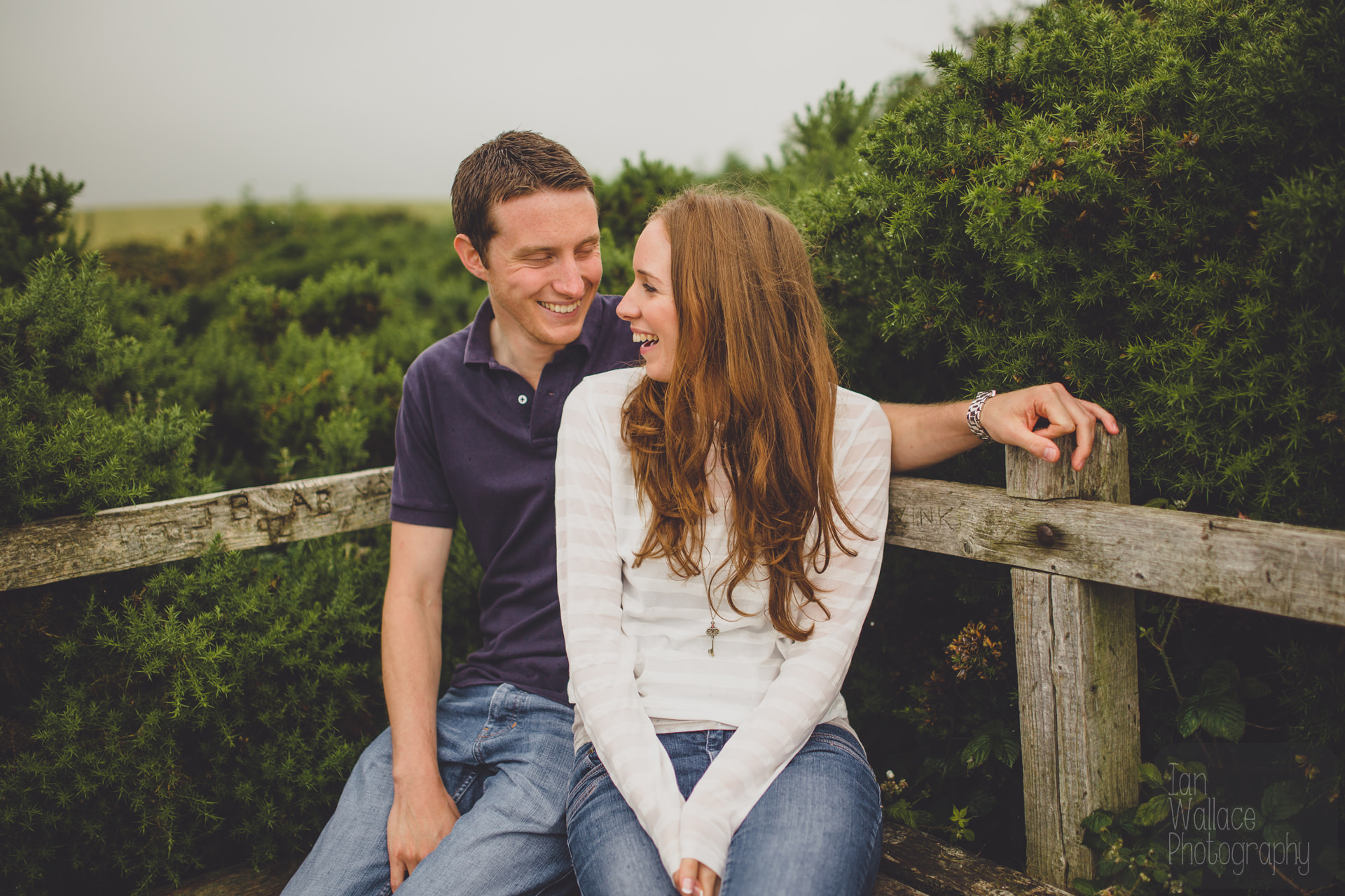 A couple laughing during a pre-wedding shoot on the East coast