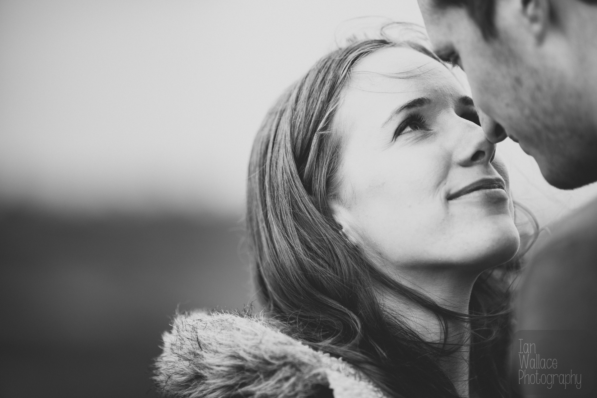 Tender romantic moment between a couple during an engagement shoot