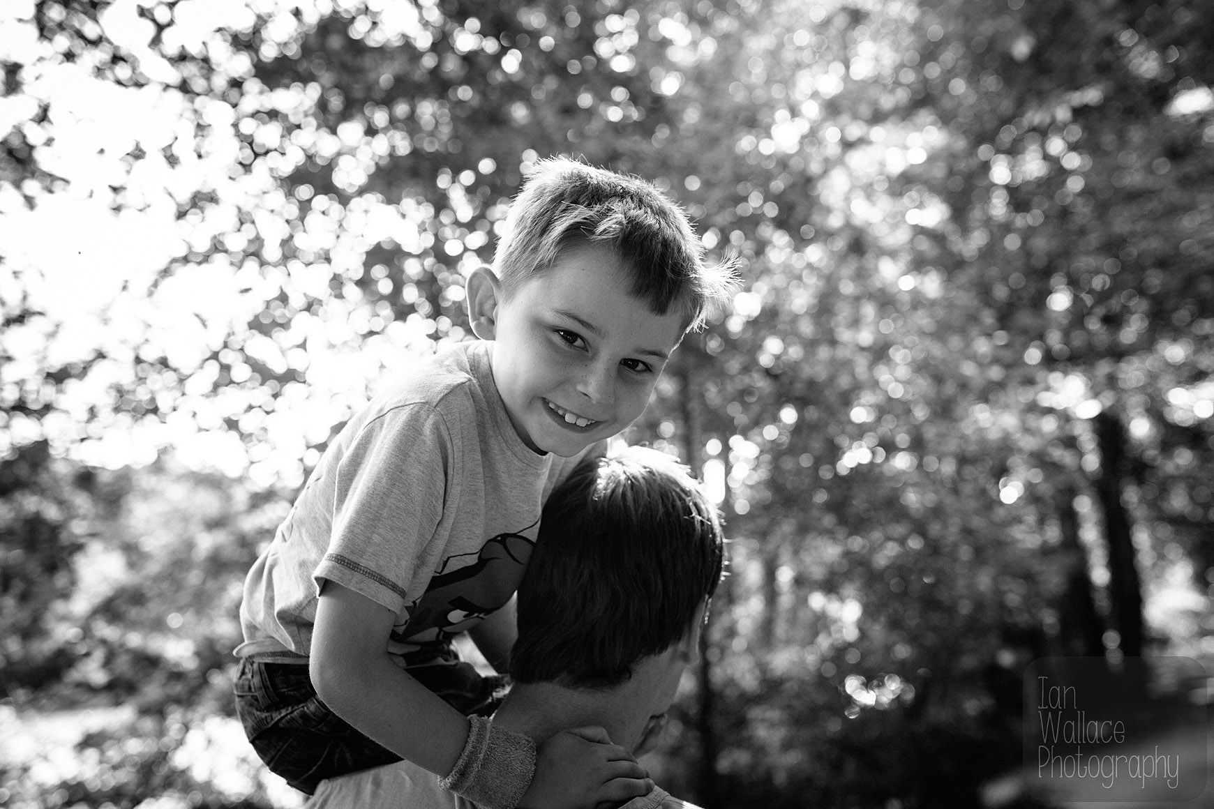 Boy having a piggy back ride during a family shoot near Barnsley
