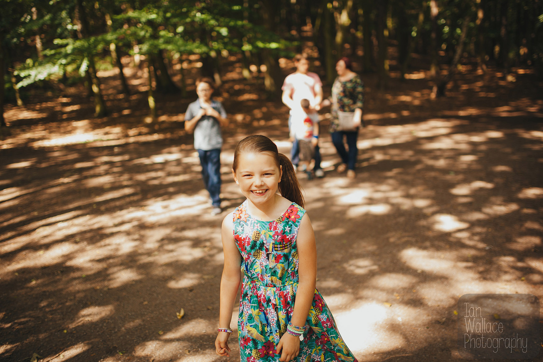 Candid shot of family walking through a wooded area near Barnsley
