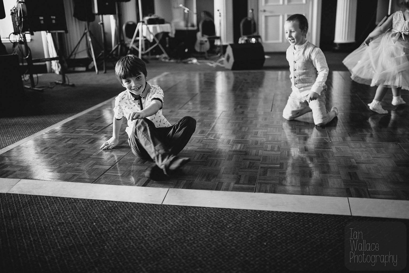 Kids break dancing on the dance floor.