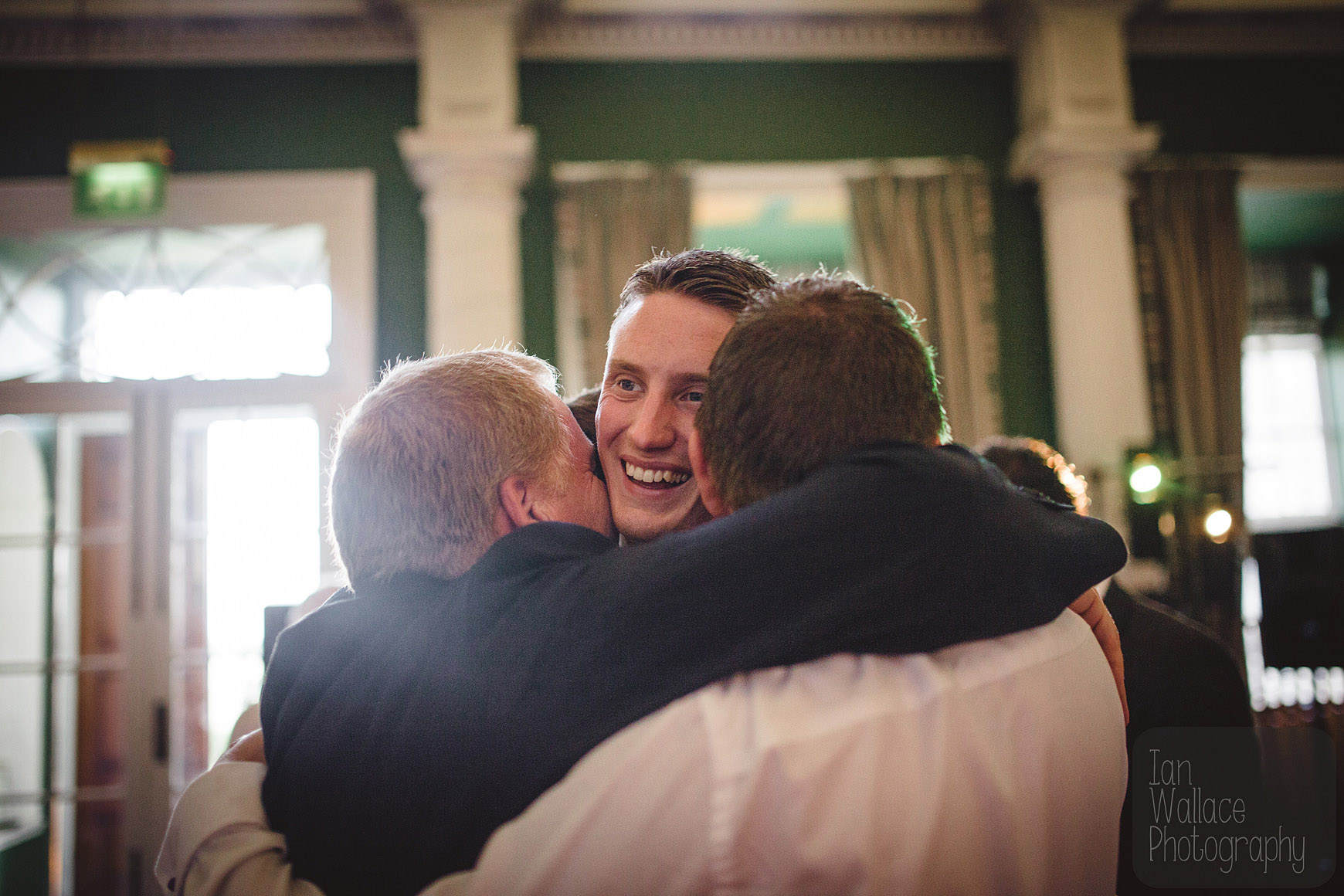 The groom getting mobbed by his friends after the first dance.