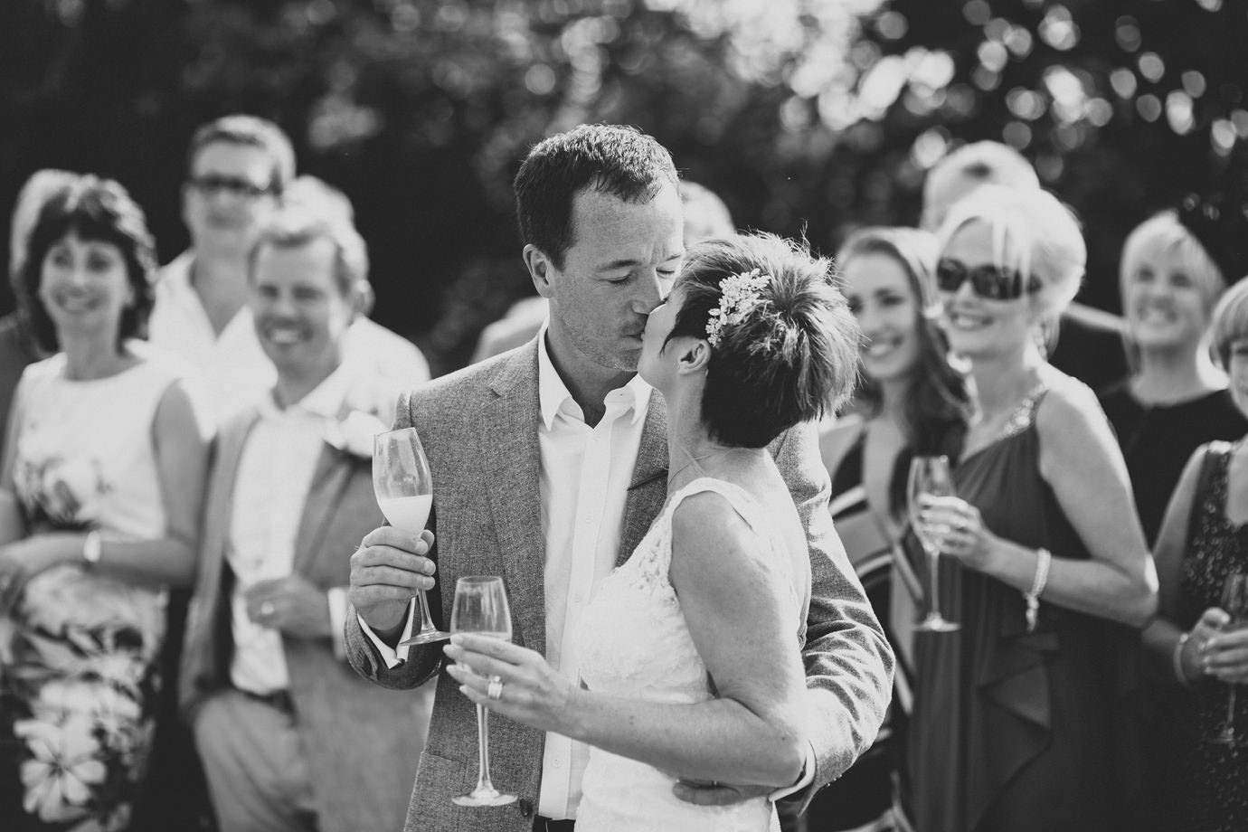 Bride and groom kiss, natural garden wedding photography