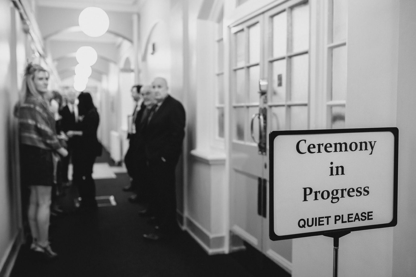 Ceremony in progress, family queuing, Manchester documentary wedding photography